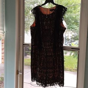 Black lace and tan overlay romper with back zipper. Size 18